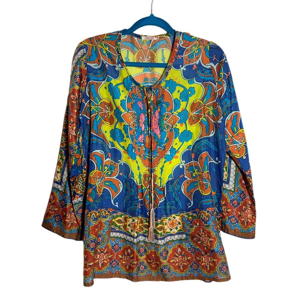 Johnny Was top, 100% silk. Its beautiful, colorful and fun to wear!